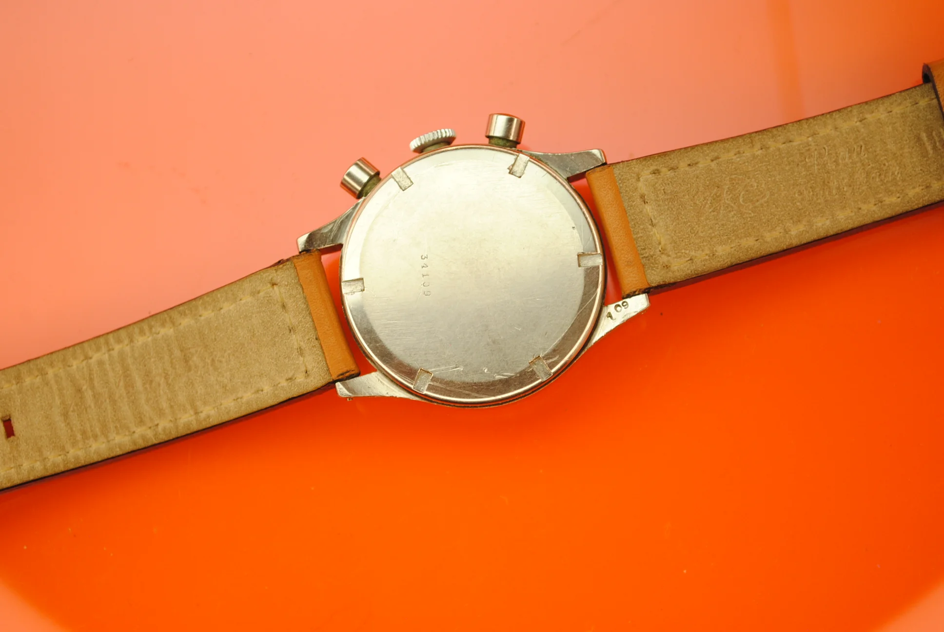 Rear view of the sold Unver chronograph showing its screw-down caseback and case number