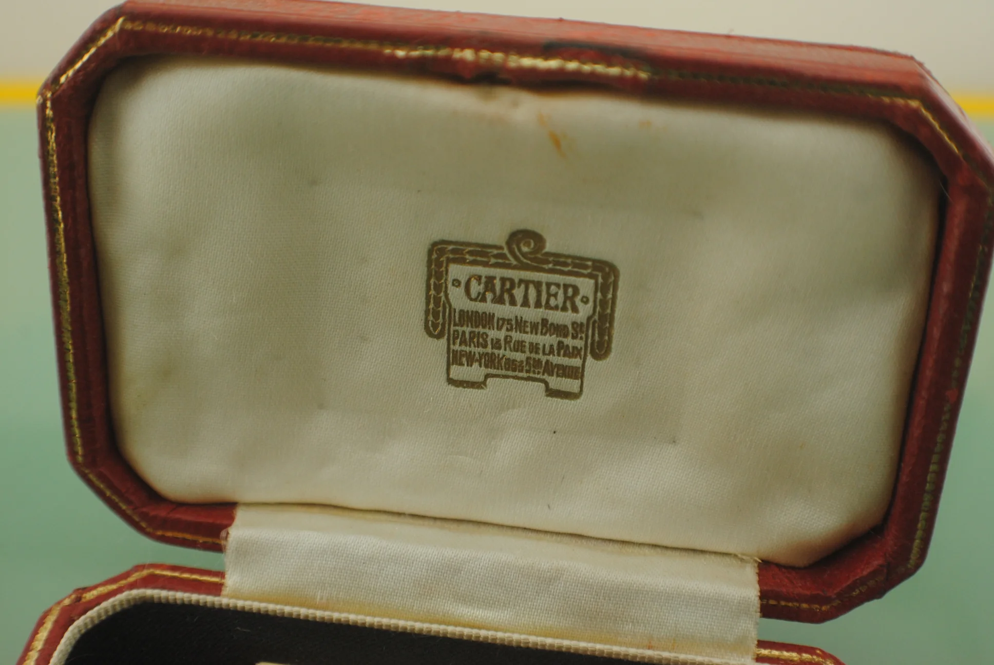 Close view of the original box interior showing the Cartier Paris London New York signature
