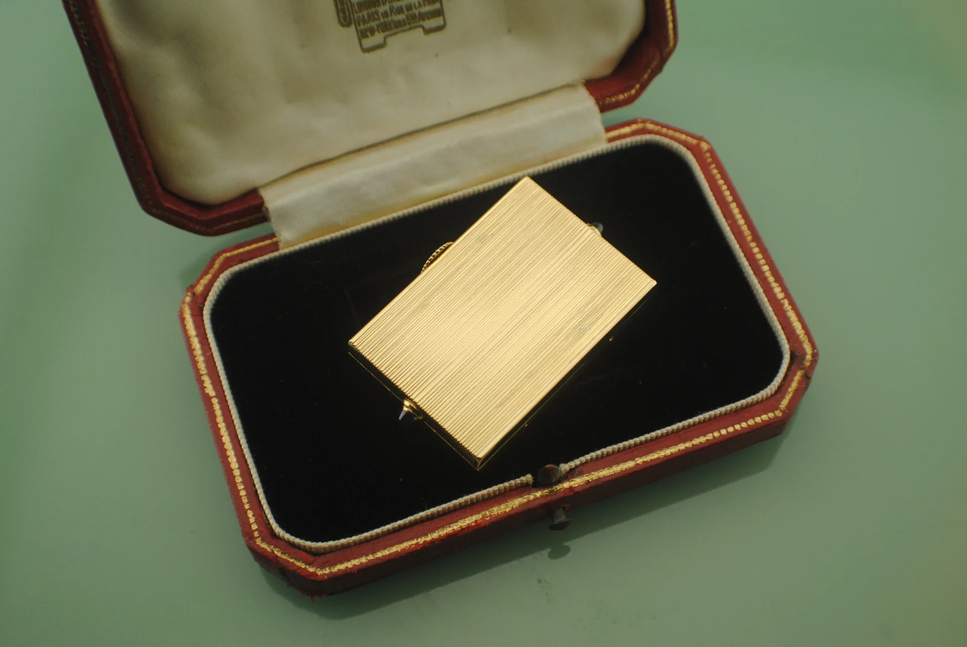 Rear view of the Cartier Guillotine watch showing its rectangular finely striated yellow-gold back panel