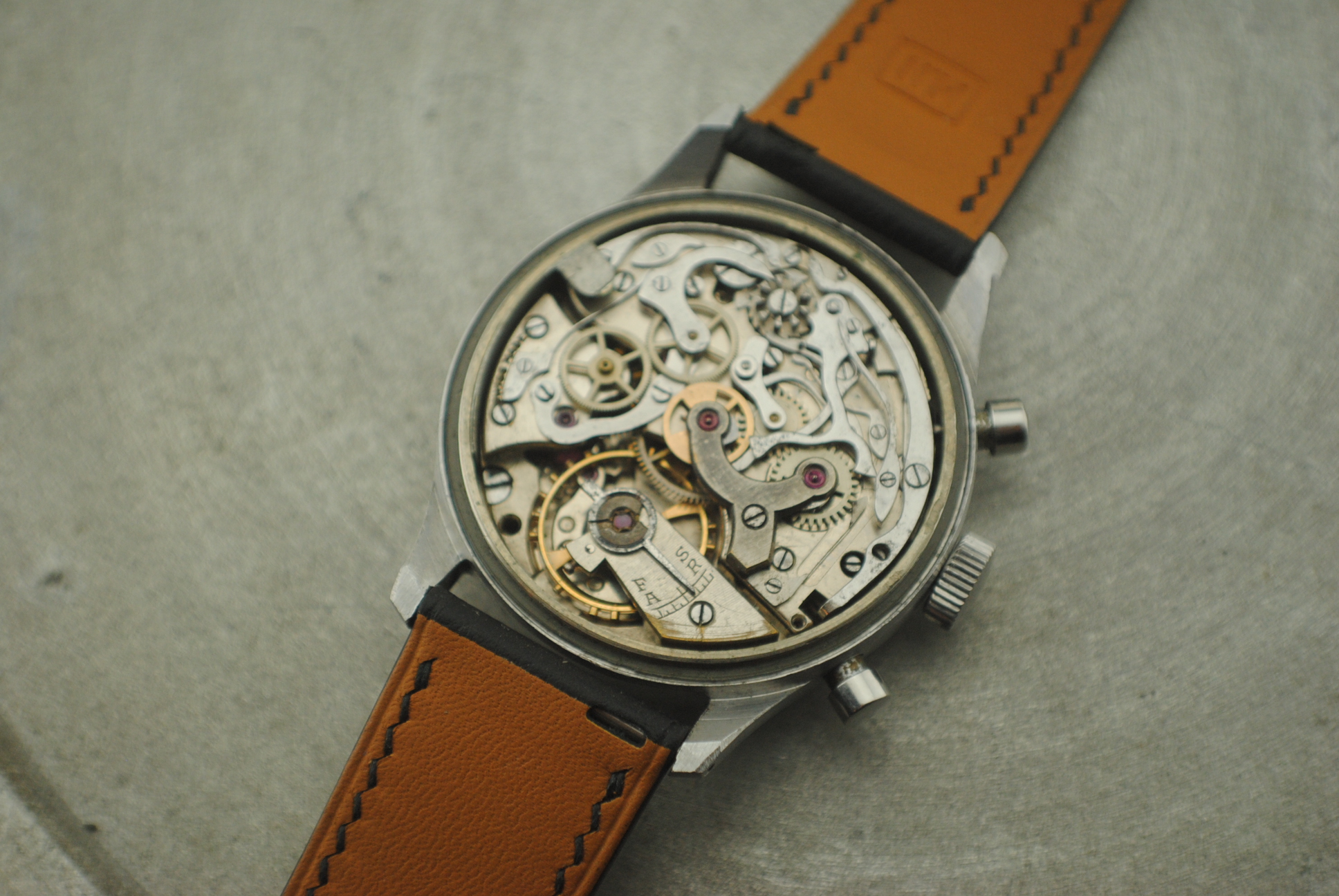 Open Marvin chronograph showing the hand-wound Valjoux 22 movement