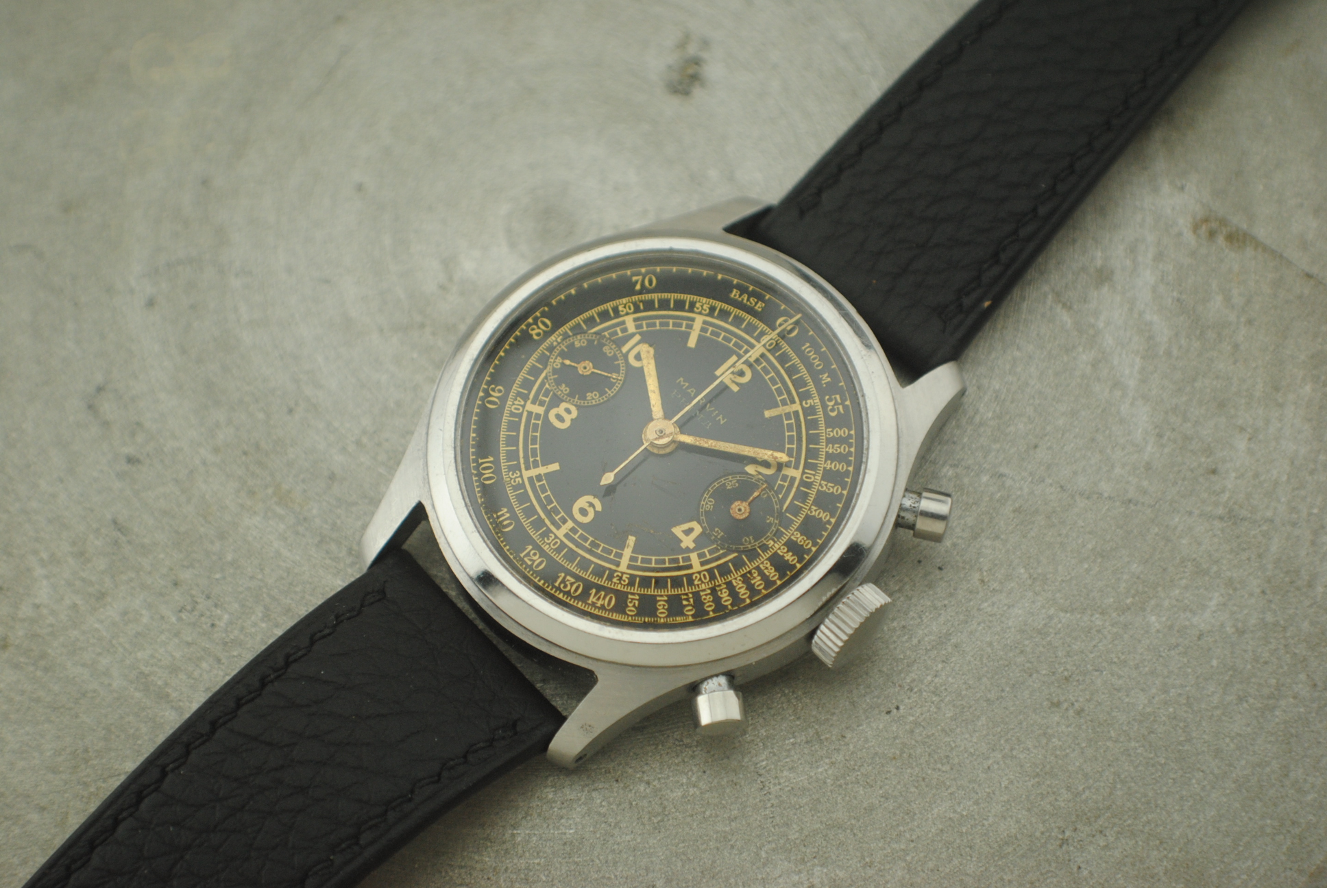 Lead exterior view of the Marvin chronograph screw-down caseback and leather strap