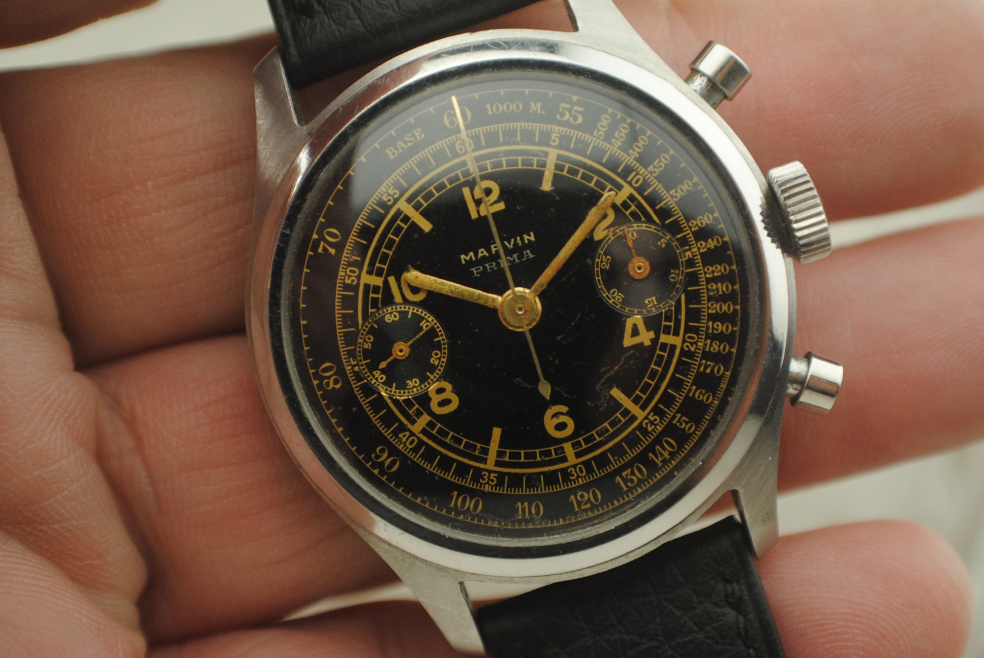 Open Marvin chronograph showing the hand-wound Valjoux 22 movement